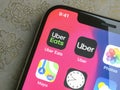 Apple iphone with Uber and Uber Eats App on screen. Uber is an American company offering different transportation services online Royalty Free Stock Photo