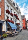 Aachen, Germany - July 31, 2022: Facade of the hotel building, with the ice cream parlor LammerskÃÂ¶tter im Hof on the ground floor