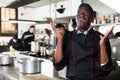 Aafrican american confident chef male in kitchen of restaurant Royalty Free Stock Photo