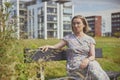 Aalborg, Denmark, July 10, 2022: Beautiful mature woman on a bench