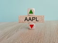 AAPL price symbol. A brick block with arrow symbolizing that AAPL index price are going down or up. Royalty Free Stock Photo