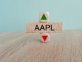 AAPL price symbol. A brick block with arrow symbolizing that AAPL index price are going down or up.