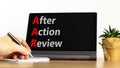 AAR After action review symbol. Concept words AAR After action review on beautiful black tablet. Beautiful white background.
