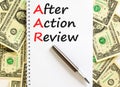 AAR After action review symbol. Concept words AAR After action review on beautiful white note. Dollar bills. Beautiful dollar