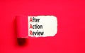 AAR After action review symbol. Concept words AAR After action review on beautiful white paper. Beautiful red paper background.