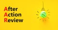 AAR After action review symbol. Concept words AAR After action review on beautiful yellow paper. Beautiful yellow background.