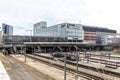 Aarhus train station with rails going under bridge. Bruun`s gallery shopping center is seen in the background. bicycle parking is Royalty Free Stock Photo