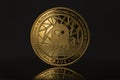 Aave Crypto coin placed on reflective surface in the dark background