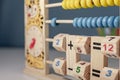 Children`s wooden game to learn the hours of a clock and simple math of addition, subtraction, multiplication and division, calle