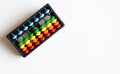 Abacus with colored beads, toy to learn counting, text and copy space Royalty Free Stock Photo