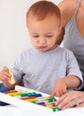 Abacus, toy and baby with mother playing, learning and education for child development on bed. Bonding, math and closeup Royalty Free Stock Photo