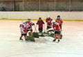 Abakan, Russia 09/12/2019: Children hockey team players clean the ice after the game.