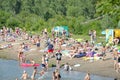 Abakan, Russia 08/04/2019: People relax on a city beach, near a small river