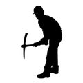 silhouette of a worker swinging his mattock tool.