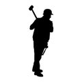 silhouette of a miner worker bringing his sledge hammer.