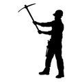 silhouette of a worker swinging his mattock tool.