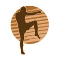 silhouette of a male muay thai martial art fighter ready to kick.