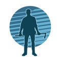 silhouette of a male worker holding a mattock axe tool.