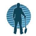 silhouette of a male construction worker ready to dig with his shovel.