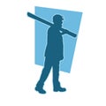 silhouette of a worker walking and shouldering wood boards. Royalty Free Stock Photo