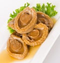 Abalones. Chinese cuisine abalone on background. Royalty Free Stock Photo