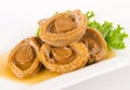 Abalones. Chinese cuisine abalone on background. Royalty Free Stock Photo