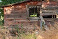 Abandon farm barn with a sunlit screen in a window