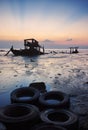 The abandon fishing boat at shore.