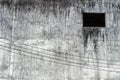 Abandon grunge grey cement wall with black dark window urban building background Royalty Free Stock Photo