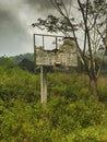 Abandon outdoor basketball court at a deep forest. this image has taken at indian forest area Royalty Free Stock Photo