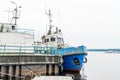 Abandon steel ship on pier with cloudy sky, close-up shot