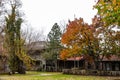 Abandonded frontier city replica with log buildings in the autumn