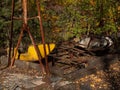 Abandoned amusement park in ghost town Pripyat. Overgrown trees and collapsing buildings in Pripyat, Chernobyl exclusion zone. Royalty Free Stock Photo