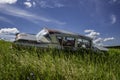 Abandoned antique blue sedan on a hillside near Wymark, SK