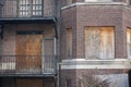 Abandoned apartment building with boarded up windows