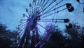 Abandoned Apocalyptic Ferris wheel and carousel in an amusement Park in a city deserted after the Apocalypse. 3D