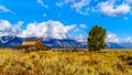 An abandoned Barn at Mormon Row with in the background cloud covered Peaks of the Grand Tetons In Grand Tetons National Park Royalty Free Stock Photo