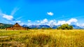 An abandoned Barn at Mormon Row with in the background cloud covered Peaks of the Grand Tetons In Grand Tetons National Park Royalty Free Stock Photo