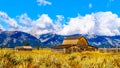 Abandoned Barns at Mormon Row with in the background cloud covered Peaks of the Grand Tetons In Grand Tetons National Park Royalty Free Stock Photo