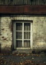 Abandoned. Barred window in an old brick building. Royalty Free Stock Photo