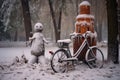 abandoned bike with a snowman built next to it in a winter park