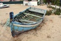 Abandoned boat on the beach. Old blue fishing on the sand. Atlantic. Portugal. Travel background Europe. Royalty Free Stock Photo