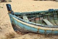 Abandoned boat on the beach. Old blue fishing on the sand. Atlantic. Portugal. Travel background Europe. Royalty Free Stock Photo