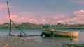 Abandoned boat on the River Torridge, pink sunset. North Devon. Royalty Free Stock Photo