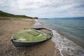 Abandoned boat on sand, Baikal lake coast, Olkhon. Royalty Free Stock Photo