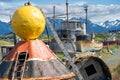Abandoned boats, ships and other junk in a junkyard in Alaska