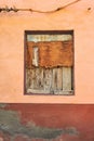 Abandoned and bordered window on an empty house from poverty and economic crisis in Santa Cruz, La Palma, Spain. Wooden