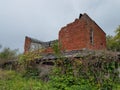 Abandoned Brick Building in a Field Royalty Free Stock Photo