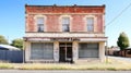 Abandoned brick building with weathered exterior and empty storefronts Royalty Free Stock Photo
