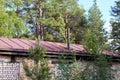 abandoned brick house with an iron roof in the forest Royalty Free Stock Photo